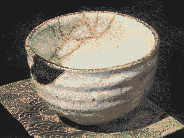 A kintsugi tea bowl with golden repair lines visible along cracks, dithered in zenburn palette